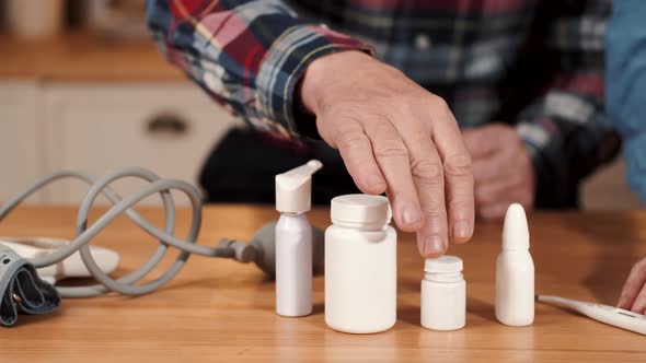 Senior Couple Checking the Medications in the Kitchen