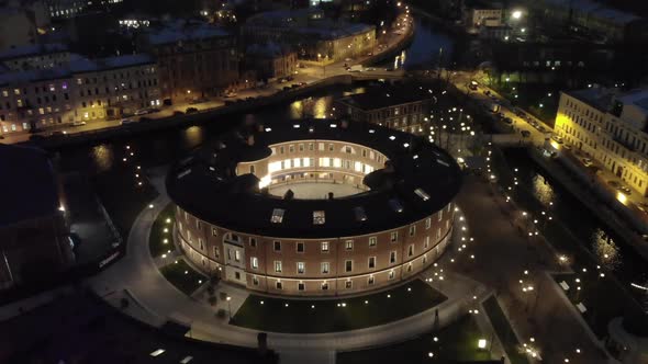 Aerial Drone View of Bottle Building of the New Holland Island in a Snowy Winter Evening