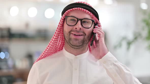 Young Arab Businessman Talking on Smartphone