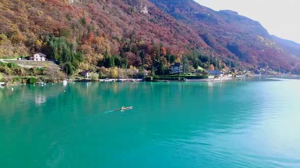 A kayaker paddles in a scenic mountain lake.