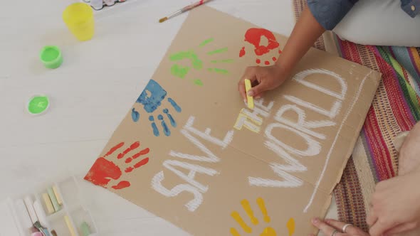 Making Save World Slogan Sign