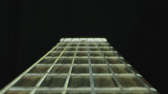 Macro Close Up of Neck and Strings of Guitalele