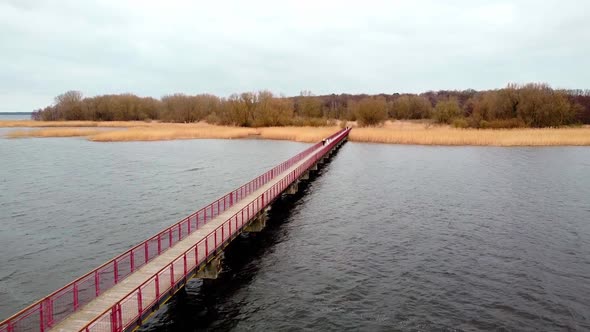 Epic cinematic drone flight near the bridge on the river near the castle