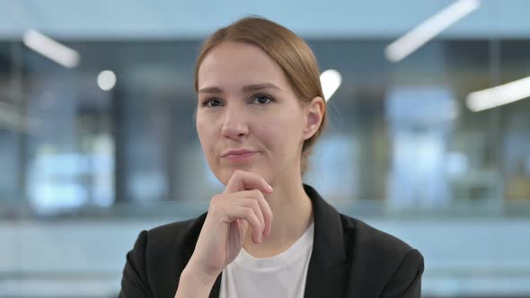 Portrait of Pensive Businesswoman Thinking and Getting Idea