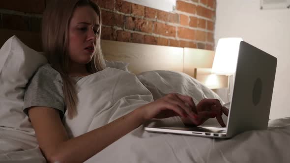 Angry Frustrated Woman Working Online at Night in Bed