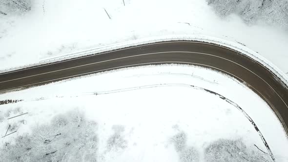 Drones Eye View  Winding Road From the High Mountain Pass in Winter