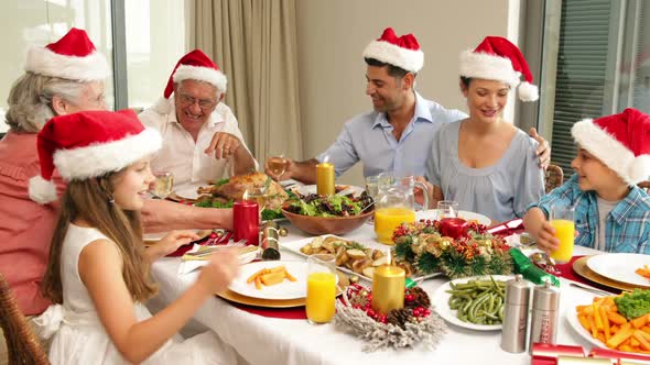 Happy extended family at the christmas dinner table