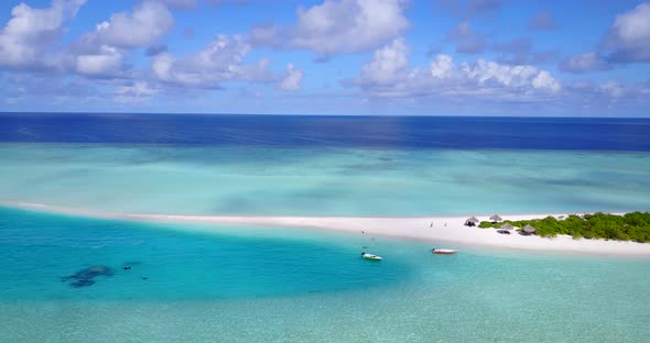 Tropical drone clean view of a sunshine white sandy paradise beach and aqua blue water background in
