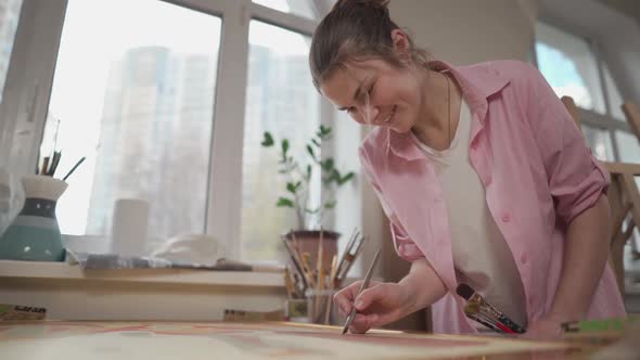 Female Artist Working in Studio