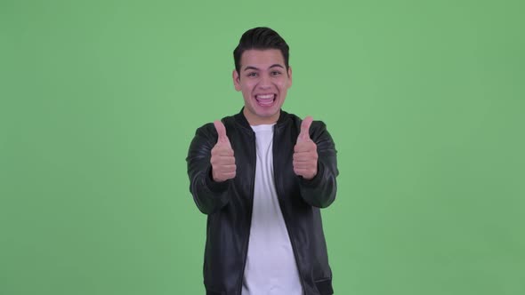 Excited Young Handsome Multi Ethnic Man Giving Thumbs Up