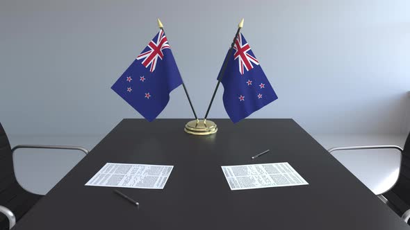 Flags of New Zealand and Papers on the Table