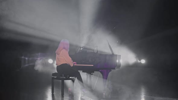 Blonde Girl Playing the Piano