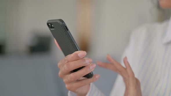 Hands of African Woman Using Smartphone