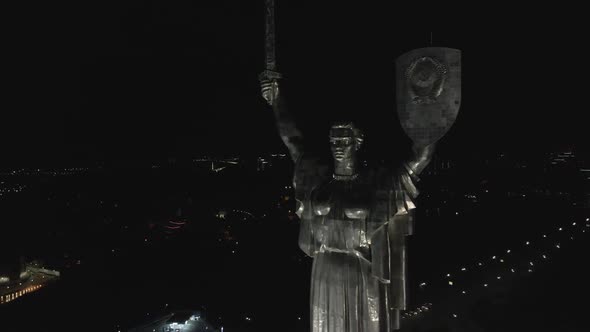 Cityscape of Kyiv in the Background of the Monument of Motherland at Night