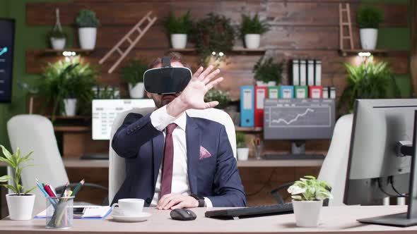 Static Shot of Office Worker with a VR Virtual Reality Headset