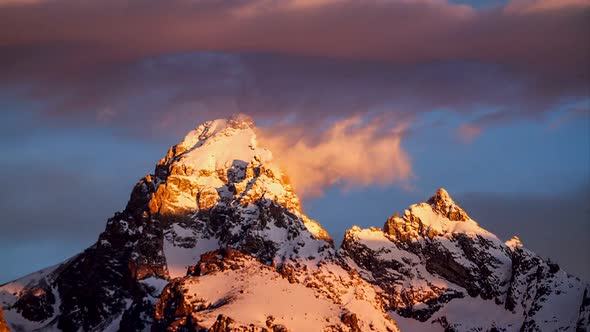 Top of Snow Covered Mountain as Clouds Move by.