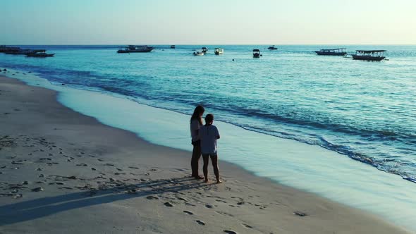 Women look beautiful on paradise bay beach voyage by shallow sea with white sand background of Bali 