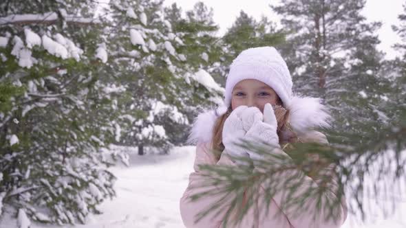 Winter Girl Blowing on Her Hands Cold Weather