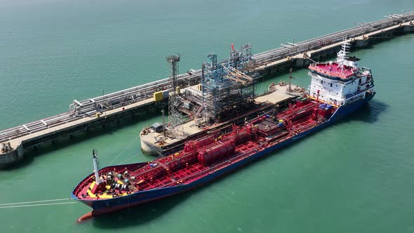 Petroleum Tanker Vessel Offloading Fuel and Oil at a Refinery Port