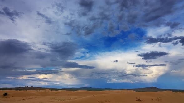 Sand Dunes with Clouds at Sunset in Gobi Desert