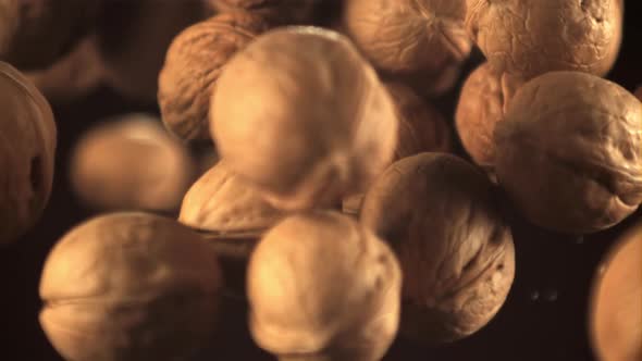 Super Slow Motion Walnuts Soar Up and Fall Down