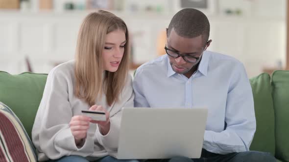 Online Shopping Payment Failure on Laptop By Mixed Race Couple