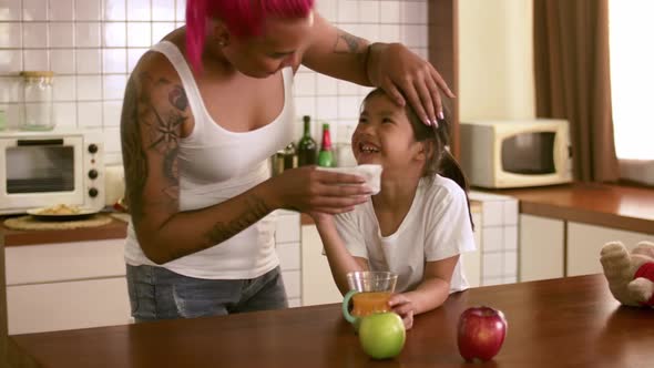 Young mother and daughter spending time together at home