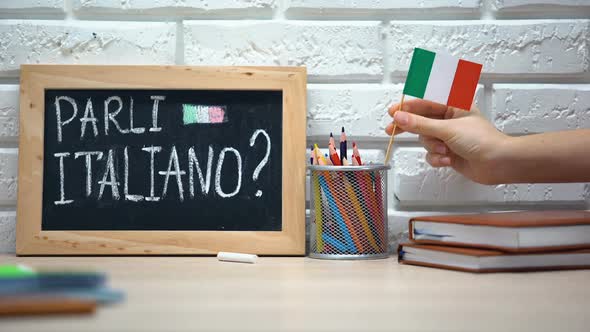 Do You Speak Italian Written on Board, Hand Putting Italy Flag in Box, Language