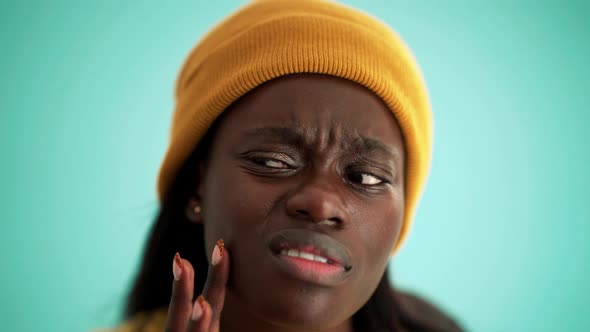 Cheerful African woman peering at the camera