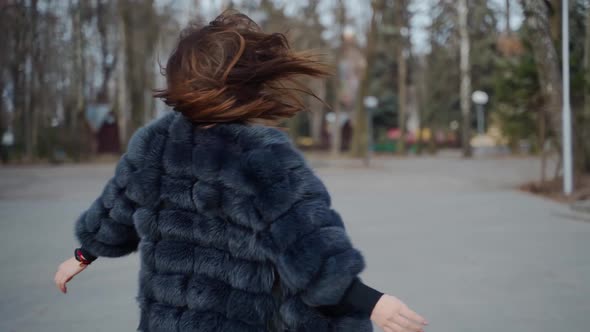 Pretty model in fur coat