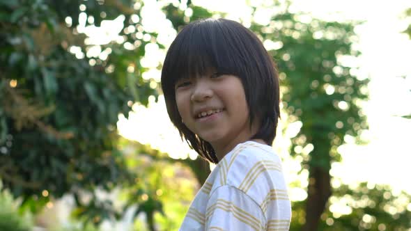 Close Up Of Happy Asian Child Outdoor