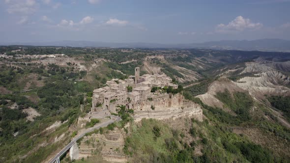 -SHOT: 180º bird's eye view-DESCRIPTION: video with drone over the civita di Bagnoregio, in the Ita