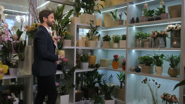 Floristical Salon Customer Choosing Potted Flowers