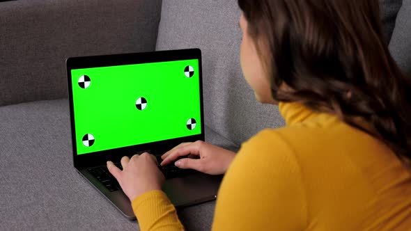 Green Screen Laptop Woman Distance Works for Computer Typing Text on Keyboard