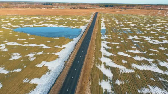 Aerial View Of Early Spring With Puddles Of Water In Fields