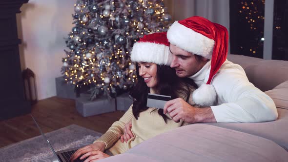 Happy couple celebrating christmas at home