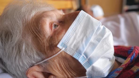 Close Up Face of Old Woman Wearing Protective Mask From Virus. Sick Lady with Medical Face Mask