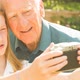 Elderly man and his Grand Daughter taking selfies - VideoHive Item for Sale