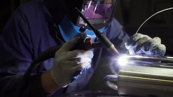 Industrial Worker Cutting and Welding Metal