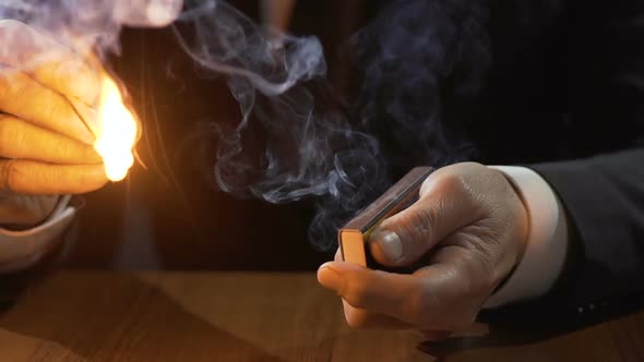 Rich Man in Expensive Suit Lighting Up Cuban Cigar With a Match, Smoking Male