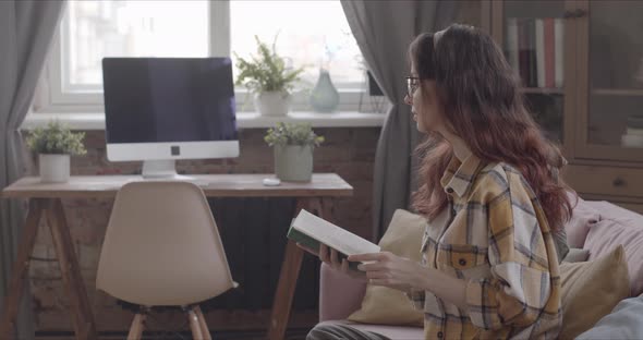 Girl Reading A Book Dreamily