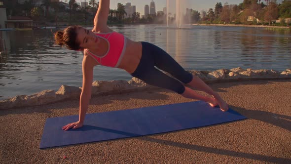 Woman Doing Yoga In The Park At Dawn