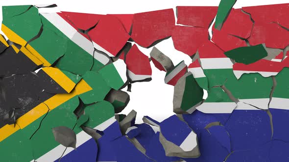 Destroying Wall with Painted Flag of South Africa