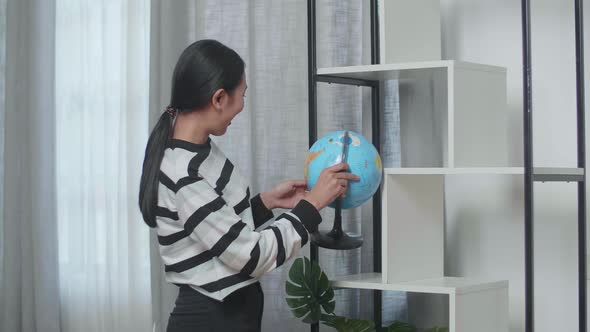 Woman Moving Into A New House Taking Stuff Out And Decorating The Habitat Bookcase