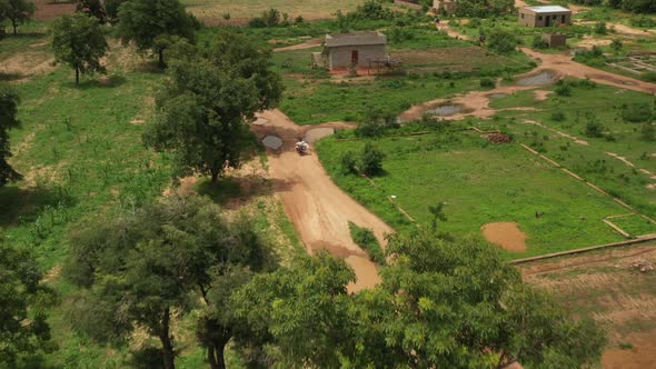 Africa Mali Village And Man Riding Motorcycle