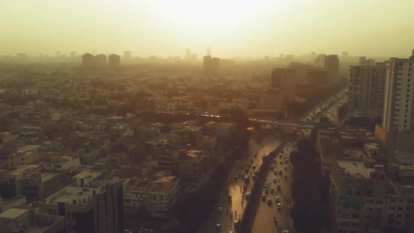 Aerial Over Shahrah E Faisal Road In Karachi With Against Golden Yellow Sunset