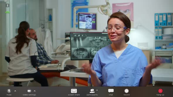 Nurse Talking with Remote Patients About Hygiene Looking at Camera