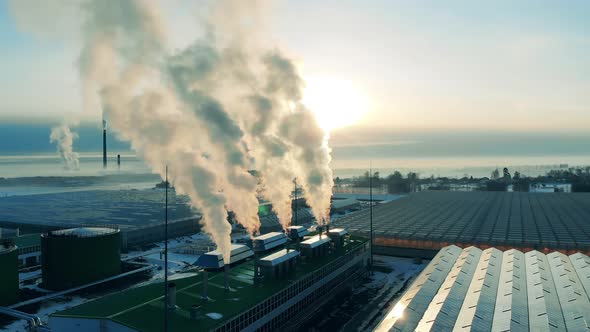 Industrial Pipes at a Modern Factory. Emissions, Ecology Problems Concept.