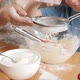 Closeup of Little Boy with Mother Sifting Flour with Sieve - VideoHive Item for Sale