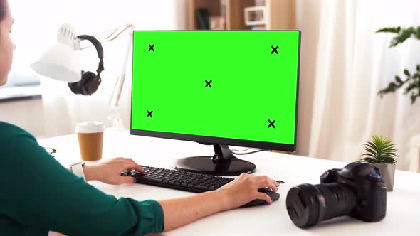 Woman with with Green Screen on Computer at Home